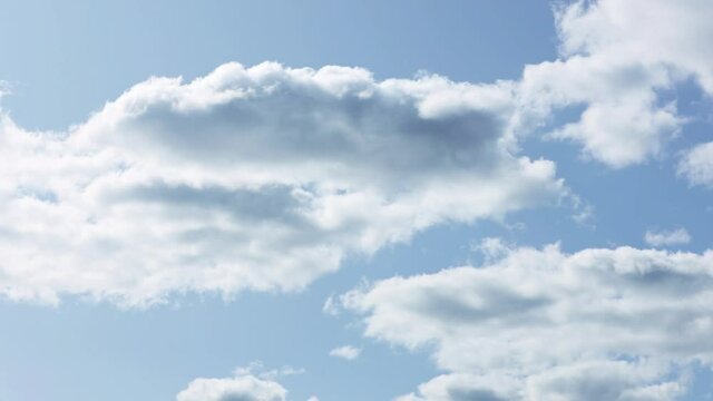 Blue sky and soft cumulus clouds timelapse