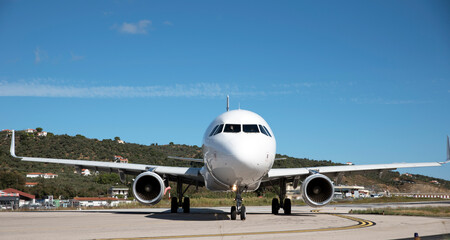 Plane take-off, transports the last tourists from the island of Skiathos to European cities, end of tourist season 2020