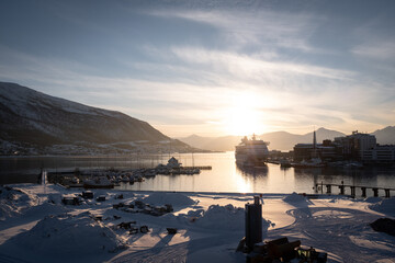 Tromsø Port with Cruise Yacht and Sunset Behind Mountains in Winter