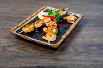 Tasty grilled shrimps with spices served on a plate