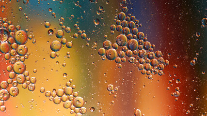 oil with bubbles on on dark blue background. Abstract background.