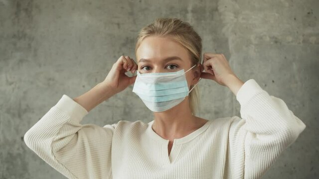 Sweden scandinavian COVID-19 doctor woman wearing face mask for coronavirus protection. European nurse portrait, business woman