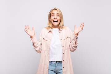  feeling happy, excited, surprised or shocked, smiling and astonished at something unbelievable
