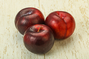 Ripe sweet plum fruit heap