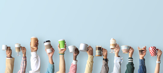 People are holding mugs and paper cups of coffee. Concept on the theme of cafes and coffee.	
