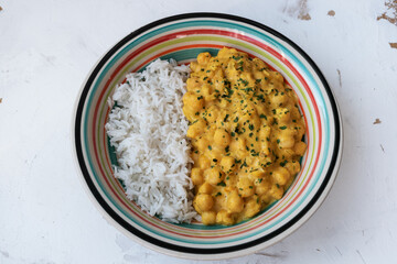 chickpeas with curry accompanied by basmati rice