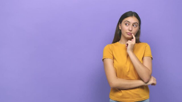 Young caucasian woman looking sideways with doubtful and skeptical expression