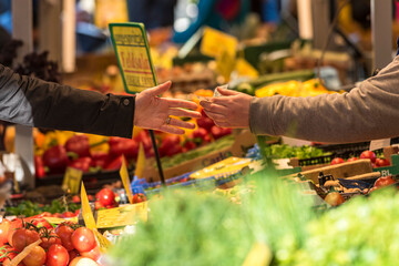 market scene handing over money paying