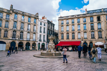 Square of old buildings crowded of people