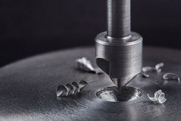 Countersink drill bit make sink in hole in steel billet. Locksmith work.