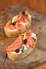 Snack - Italian bruschetta on a wooden board, traditional food, high key