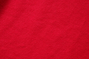 Red fabric cloth texture background close up