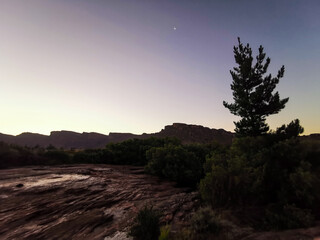 Silhouette of cliffs in the mountain rockpools at De Pakhuys in the Rocklands, Cederberg, South Africa, Night time adventure exploration 