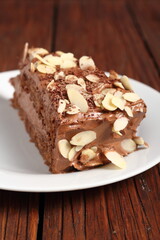 Chocolate sandwich cake garnished with flaked almonds