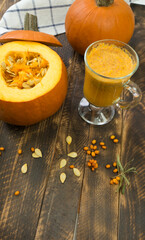 Pumpkin at the wooden table in the string bag shopper.