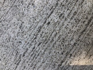 Diagonal lines in concrete from smoothing texture 