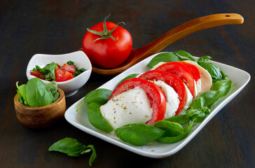 caprese salad  with buffalo mozzarella, tomato and basil with olive oil
