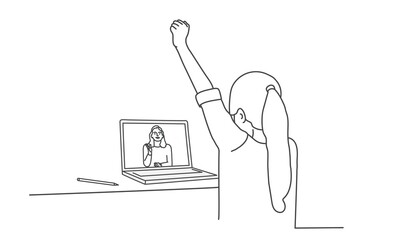 Girl sitting at a table in front of a laptop with a raised hand. Back view.