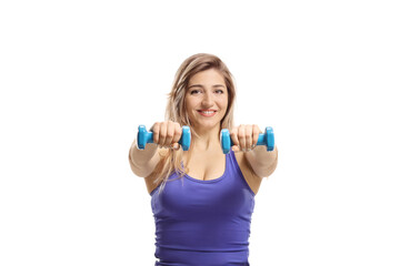 Woman exercising with dumbbells and smiling