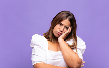young blonde woman feeling bored, frustrated and sleepy after a tiresome, dull and tedious task,...