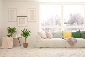 White living room with sofa and winter landscape in window. Scandinavian interior design. 3D illustration