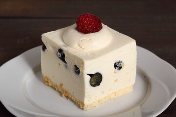 Frozen cheesecake with blueberry and raspberry