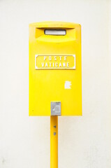 Yellow mailbox in Vatican city.