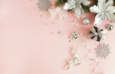 Christmas background . Xmas or new year decorations on pink background with empty copy space for text. holiday concept for postcard or invitation. top view.