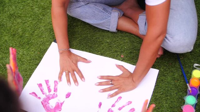 kids are making art and painting with Woman