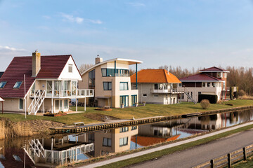 Fototapeta na wymiar Modern detached houses in Hindeloopen, Netherlands, Europe