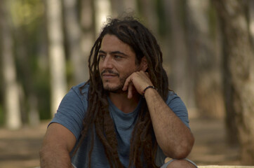 Closeup shot of an attractive man with dreads