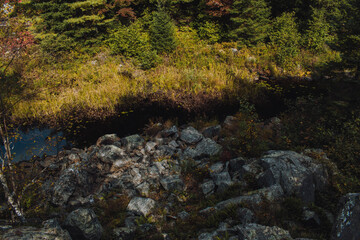 Naklejka na ściany i meble rocky hill with a creek in the background