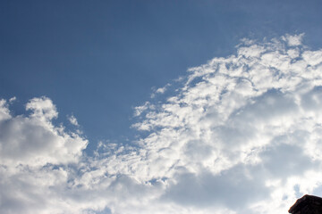blue sky with white fluffy clouds