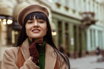 Outdoor fashion, lifestyle portrait of happy smiling woman wearing elegant autumn, winter outfit:...