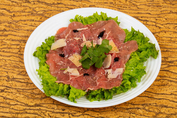 Beef carpaccio with parmesan cheese