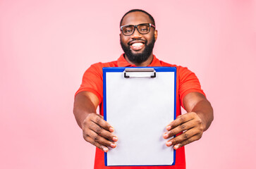 Young african american inspector man wearing glasses holding clipboard checklist with surprise face isolated over pink background.