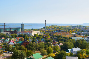 Small town with houses, factories and trees top view.