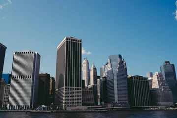 Foto op Plexiglas Modern skyscrapers near river in New York City © BullRun