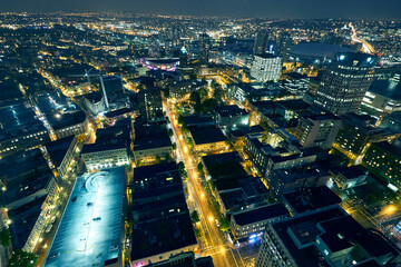 Fototapeta na wymiar Aerial view of rooftops of downtown Vancouver illuminated at night
