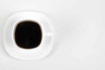 Cup of coffee on a white background. White cup and saucer.