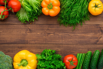 Healthy eating ingredients: fresh vegetables, fruits and superfood. Wooden background