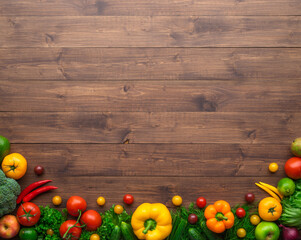 Healthy eating ingredients: fresh vegetables, fruits and superfood. Wooden background