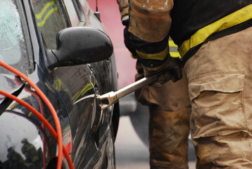 Fireman using the jaws of life.