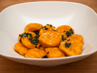 Carrot gnocchi with butter and sage
