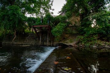 Fototapeta na wymiar A Small Abandoned Dam in a Creek in Elkins Park, Pennsylvania