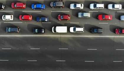 Aerial. Traffic jam with cars on a highway. Peak hour. Top view from drone.