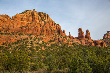 Fototapeta na wymiar A formation of red sandstone rocks and juniper trees outside the city of Sedona, Arizona