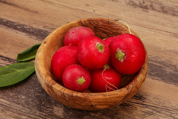 Ripe fresh radish heap over wooden