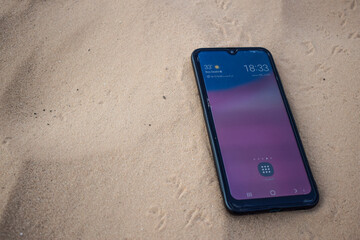 Mobile phone  picture on the background of desert sands