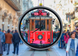 People going to work in the morning, traditional red tram in the background - Istanbul, Turkey